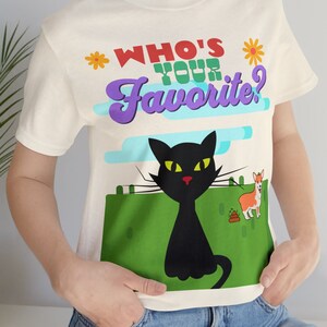 May include: White t-shirt with a black cat and a llama graphic. The text on the shirt reads "Who's Your Favorite?"