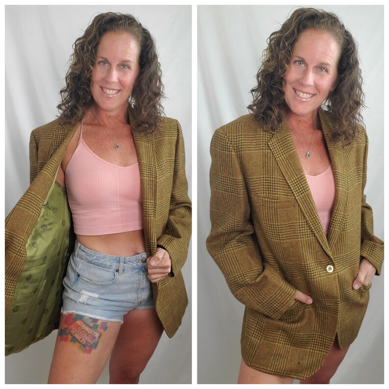 May include: A brown plaid blazer with a single-button closure and two front pockets. The blazer has a green lining with a floral pattern. The blazer is a classic style, suitable for various occasions.