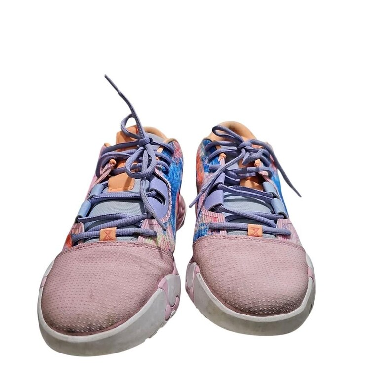 May include: Pair of colorful athletic shoes with pink, blue, and orange accents. The sneakers have light purple laces and a white sole. The design features a mix of patterns and colors, creating a vibrant look.