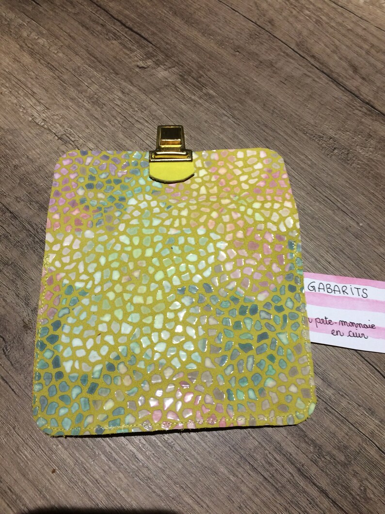 Yellow leather wallet and scales