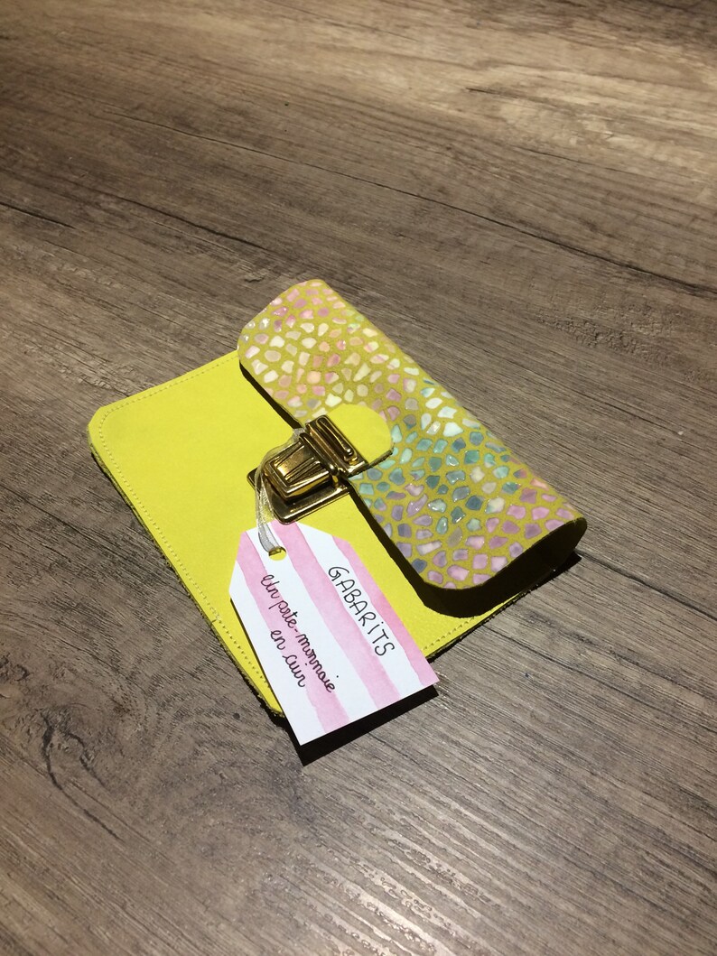 Yellow leather wallet and scales