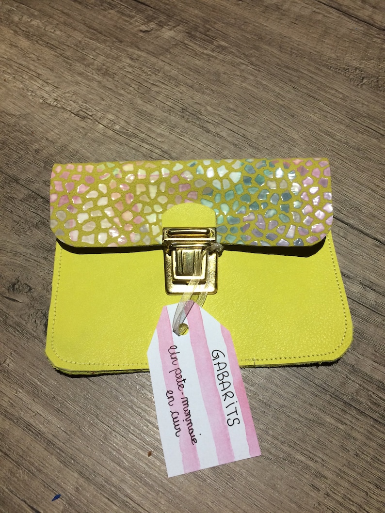 Yellow leather wallet and scales