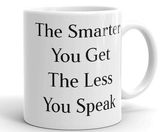 May include: White ceramic mug with black text that reads "The Smarter You Get The Less You Speak".