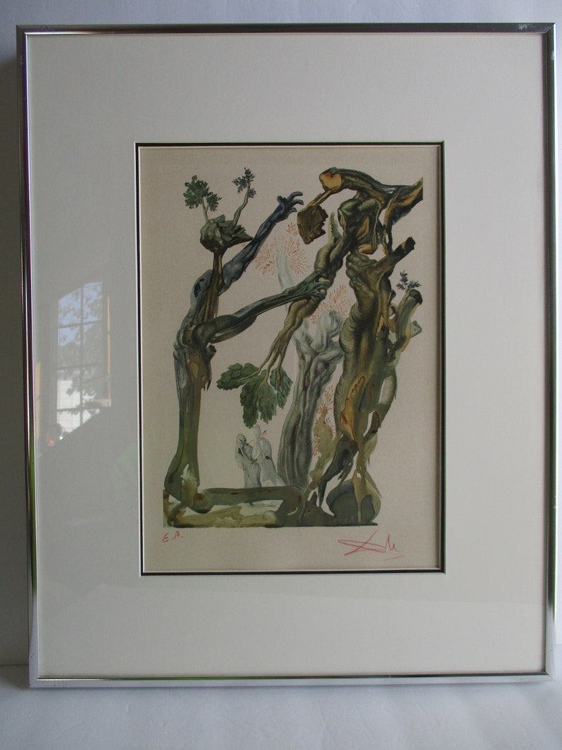 May include: A framed print of a surrealist artwork featuring a tree with intertwined branches and limbs, creating a human-like figure. The artwork is in shades of green, brown, and white, with a signature in the bottom right corner.