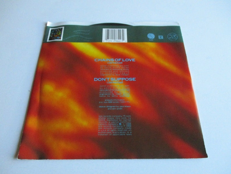 May include: A red, orange and yellow gradient background with white text that reads "Chains of Love" by "The Cure" and "Don't Suppose" by "The Cure".