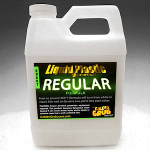 May include: A white quart bottle of Liquid Plastic Premium Regular Formula. The label is green and gold with the text "Liquid Plastic Premium Regular Formula". The label also includes instructions for use and safety warnings. The bottle is sitting on a white surface.