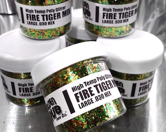 May include: Four small jars of green, red and gold glitter labelled "High Temp Poly Glitter Fire Tiger Mix Large .030 Hex" and "Golden Hub Life Co."