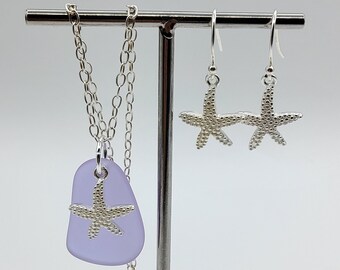 May include: A set of silver jewelry featuring a lavender sea glass pendant with a silver starfish design and matching silver starfish earrings.