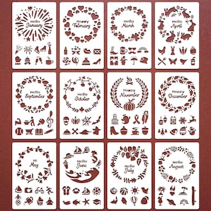 May include: A collection of twelve stencils, each with a month-themed design. The stencils feature a circular wreath with the month's name and associated icons, like hearts for February and pumpkins for October. The stencils are light brown.