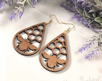 Walnut wood earrings with cutout honeycomb and honeybee design