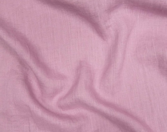 May include: Close-up of a light pink linen fabric with visible texture and folds. The fabric has a soft, matte appearance and a subtle sheen. The image showcases the natural texture and color variations of the material.