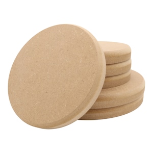 May include: A stack of six unfinished wooden circles, ideal for crafting projects. The circles are made from natural wood and have a smooth, sanded surface.