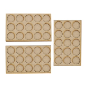 May include: Three wooden trays with circular cutouts for holding paint pots. Each tray has 18 circular cutouts.
