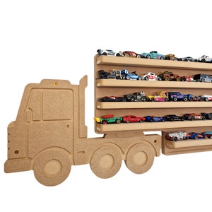 May include: A wooden toy truck shelf with five shelves for storing toy cars. The truck is brown and has a white cab. The shelves are filled with toy cars in various colours.