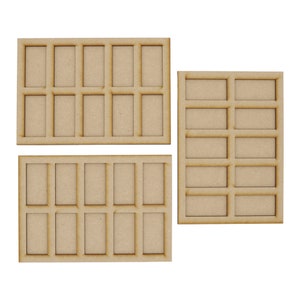 May include: Three wooden trays with rectangular compartments. The trays are unfinished and have a natural wood colour.
