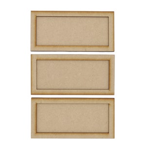 May include: Three unfinished wooden rectangular frames in a light brown colour. The frames are stacked on top of each other.