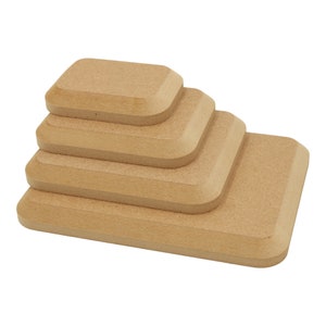 May include: Set of five wooden display risers, stacked in a pyramid shape. The risers are made of natural wood and have a smooth, rounded edge. They are perfect for displaying small items, such as jewellery, candles, or other crafts.