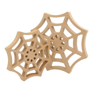 May include: Two wooden spiderwebs, one on top of the other, with a brown colour and a detailed design.