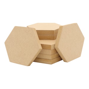 May include: A stack of 10 unfinished hexagon wood shapes. The shapes are light brown and have a smooth surface.
