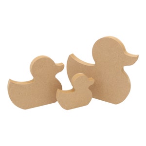May include: Three wooden duck shapes in different sizes. The ducks are all brown and have a smooth, unfinished surface.