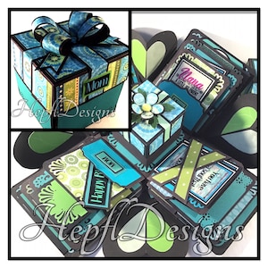 May include: A teal blue and green explosion box with a black and white patterned design. The box has a small square box on top with a teal blue and green patterned design and a black bow. The box has a label that says "Mom" and another label that says "Happy Birthday".