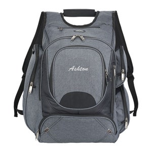 May include: A gray and black backpack with the word "Ashton" embroidered on the front. The backpack has multiple pockets and zippers.