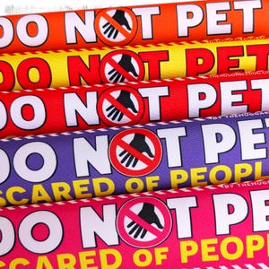 DO NOT PET, scared of people. Warning leash sleeves for fearful dogs.