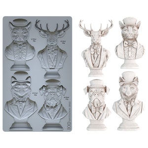 May include: A silicone mold with six different animal busts, including a cat, deer, fox, and dog. Each bust is wearing a top hat and bow tie. The mold is labeled "IOD Invitation Only".