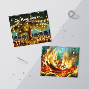 May include: Two spiral-bound calendars. One features a festive outdoor scene with the text "The Ring Sets Out 2026 Calendar." The other depicts a golden ring engulfed in flames. Both have colorful illustrations.