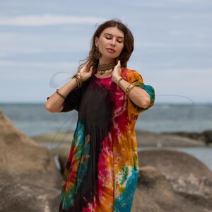 Plus size tie-dye harem romper for bohemian lifestyles, designed in breathable cotton with a one size fit. Perfect for spiritual travelers, music festival lovers, or beach days. Ethically handmade and naturally dyed, this flowy jumpsuit flatters every curve and offers comfort, movement, and soul.
