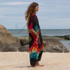 One-of-a-kind plus size tie-dye romper in hand-dyed cotton, featuring relaxed fit and pockets. Flowy boho jumpsuit for festivals, music events, and summer adventures. Perfect for beachwear or lounging in comfort and color. Sustainable clothing for free spirits who want unique handmade fashion that flatters curves.