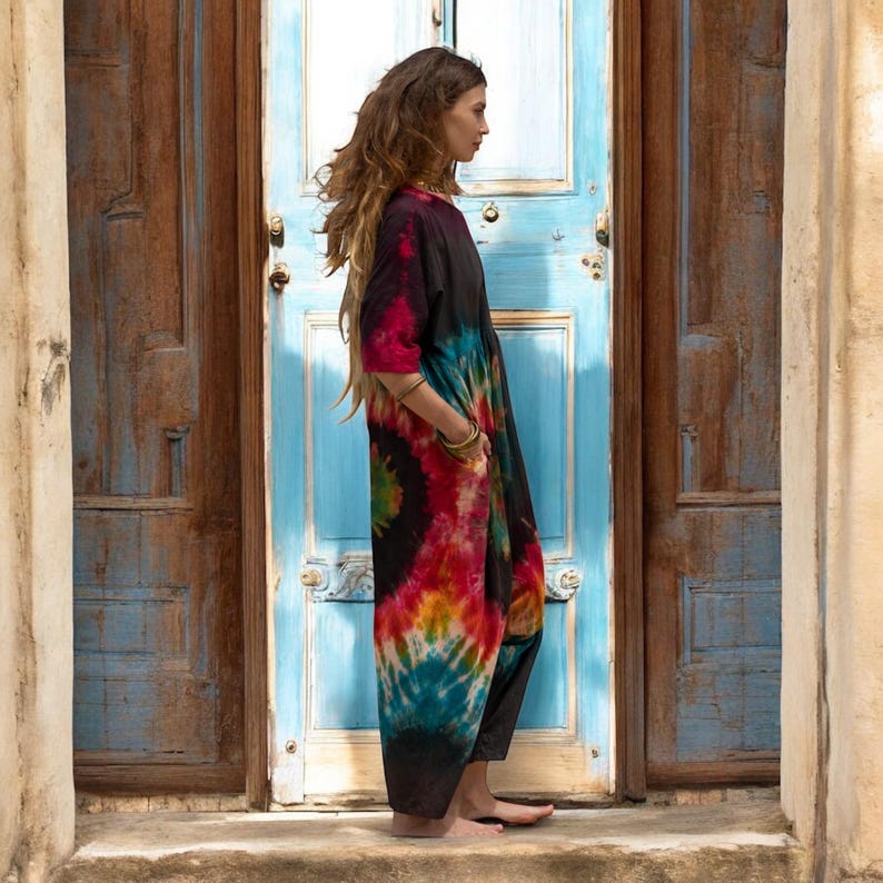 Vibrant plus size romper made from hand-dyed jersey cotton in swirling psychedelic tones. Relaxed fit harem jumpsuit designed for comfort, expression, and confidence. Festival-ready boho outfit for women who value individuality, breathable fabrics, and handmade ethical fashion.
