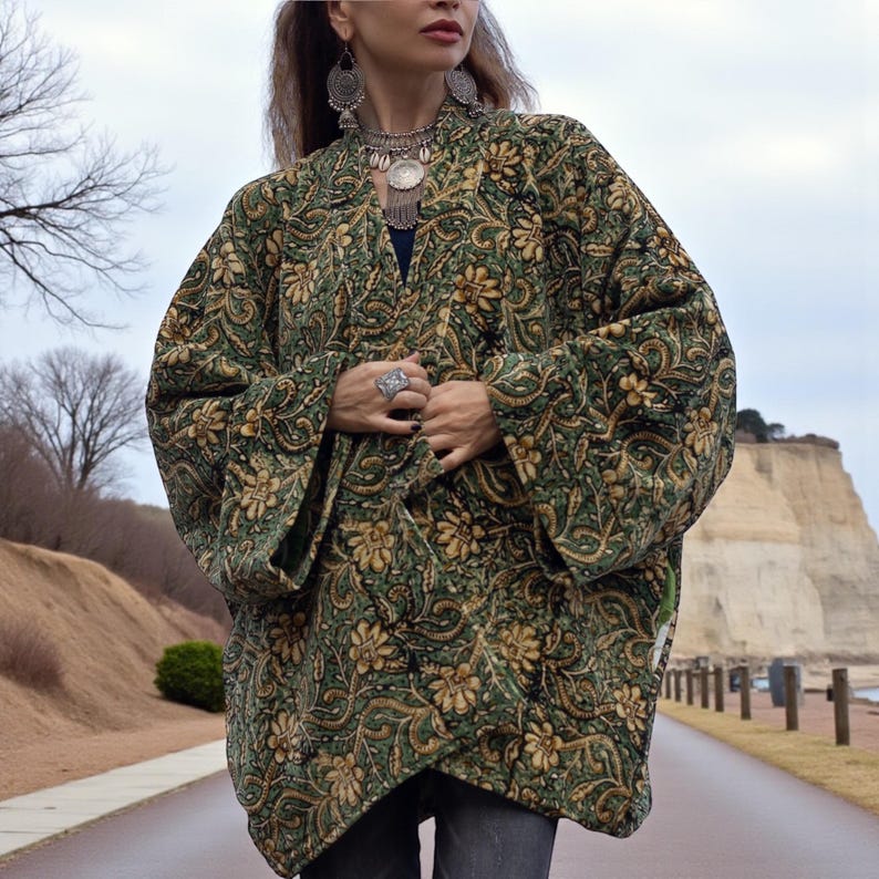 Close-up detail of green and gold velvet floral kimono jacket showing intricate artisan pattern, soft texture, and handmade craftsmanship — vintage-inspired boho fashion by ZinniaPearl.