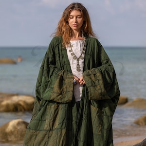 Detailed texture shot of the Firest Green canvas. Focuses on the raw, deconstructed seams and the heavy weave of the cotton. The fabric appears soft yet durable, with a stone-washed matte finish that highlights the high-quality construction.