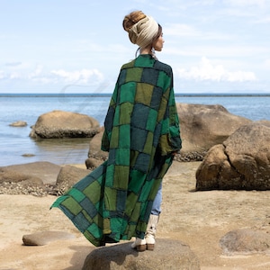 Featuring a vintage-inspired patchwork of vibrant forest green hues, The Veda Duster is truly one-of-a-kind, blending artistry and charm. Crafted from medium-weight cotton, the Veda Duster is soft, cozy, & ideal for layering in all seasons.
