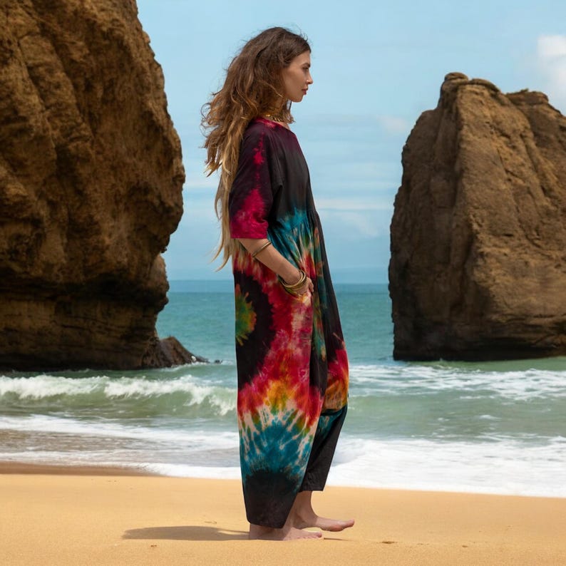 Ethically crafted tie-dye jumpsuit with a laid-back silhouette and vivid color design. This one size plus romper is a festival staple and a dreamy beach companion, made from soft, breathable cotton. Ideal for gifting to artistic, spiritual women who cherish handmade fashion.