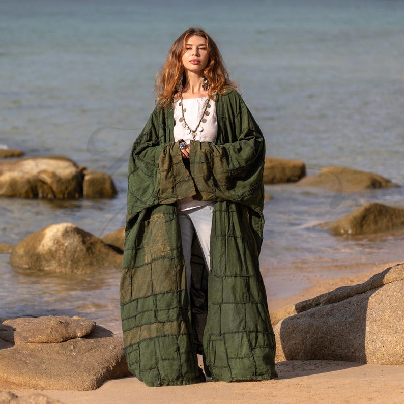 Full-length front view of the Forest Moss Green patchwork coat. The heavy cotton canvas drapes elegantly, offering a structured yet bohemian look. The deep green color evokes an ancient forest vibe. Features wide sleeves and a relaxed, open fit suitable for plus-size styling.