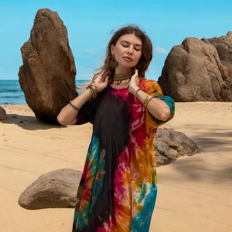 Flowy harem jumpsuit with boho energy, made for warm-weather adventures and soulful living. Hand-dyed in earthy jewel tones with wide-leg comfort and a flattering plus size fit. From music festivals to morning meditations, this tie-dye romper blends artistry with functionality.