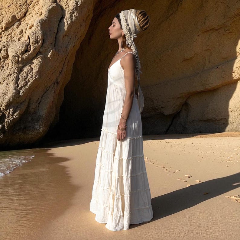 Step into your sacred “yes” in the Savita raw cotton wedding dress—a breezy, handcrafted gown for plus-size and petite boho brides alike. With its plunging neckline, stretch back, and tiered silhouette, this dress brings comfort and poetic movement to beach ceremonies, desert vows, or festival elopements. Made from breathable natural fabric, it’s perfect for those seeking slow fashion, ethical elegance, and goddess-inspired wedding wear.