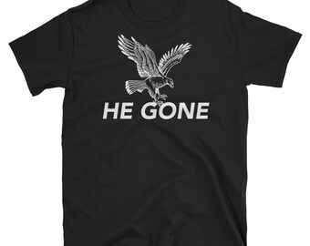 May include: Black t-shirt with a white eagle graphic and the text "HE GONE" printed on the front.
