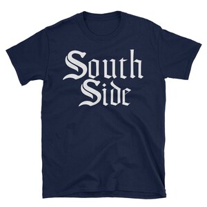 May include: A navy blue t-shirt with white text that reads "South Side" in a gothic font.