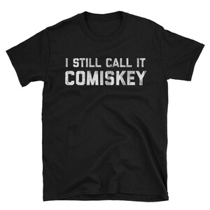 May include: Black t-shirt with white text that reads "I still call it Comiskey".