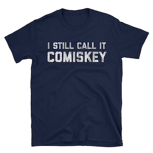 May include: Navy blue t-shirt with white text that reads "I still call it Comiskey".