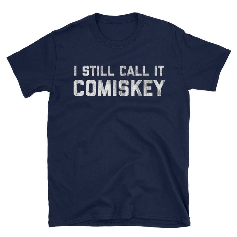 May include: Navy blue t-shirt with white text that reads "I still call it Comiskey".