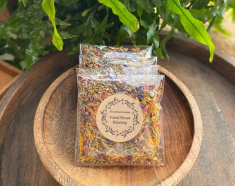 May include: Three small bags of dried flower petals for facial steam. The label on the front reads "Three Room Boutique Facial Steam Relaxing".