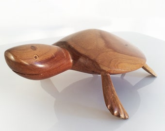 Rare hand-carved wooden turtle from Pitcairn Island signs JACOB WARREN