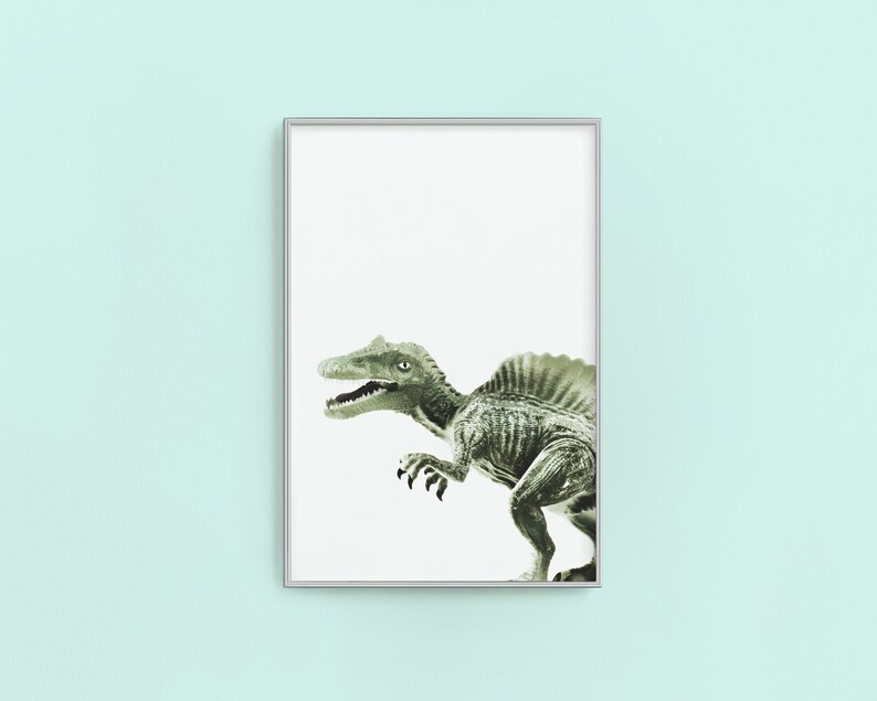 May include: A framed print of a green dinosaur with a frill on its back, against a white background.