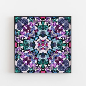 May include: A framed artwork featuring a symmetrical pattern of colorful butterfly wings. The wings are arranged in a circular pattern, creating a kaleidoscope effect. The colors are vibrant and include shades of blue, purple, pink, and green.