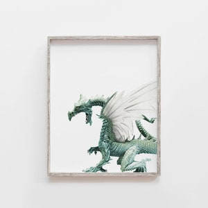 May include: A framed print of a green dragon with white wings, the dragon is in a defensive pose with its head turned to the side.