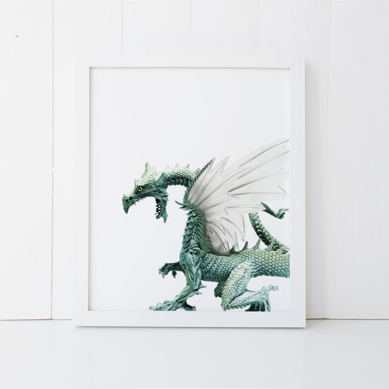 May include: A green dragon with white wings, standing on a white background.